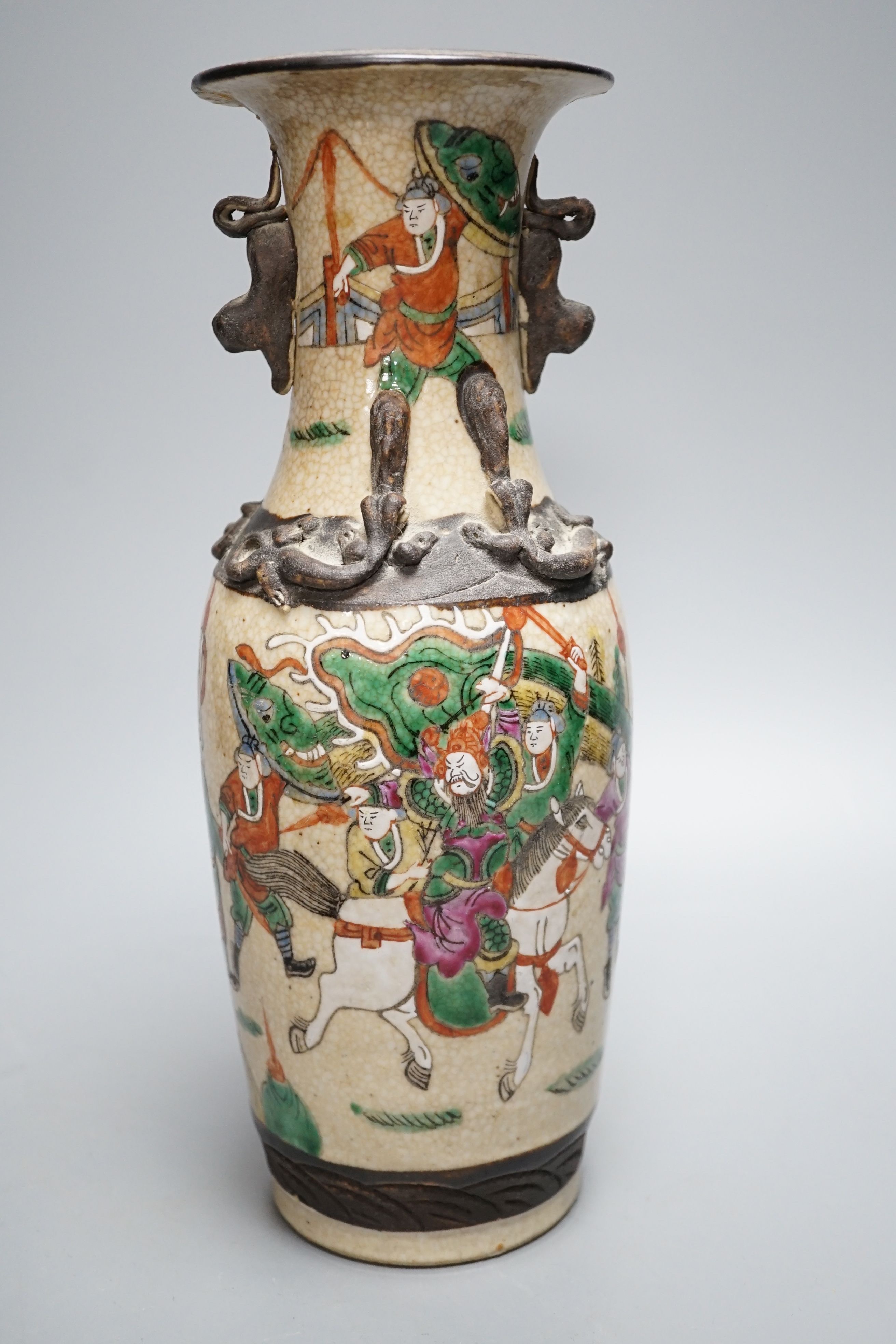 A Chinese famille rose crackleglaze vase, 29cm, together with a famille rose teapot and a crackleglaze celadon ground bottle vase